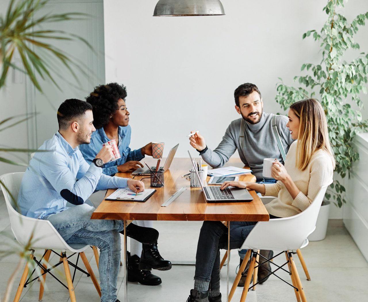 Group of young business people using laptop having a meeting or presentation and seminar in the office