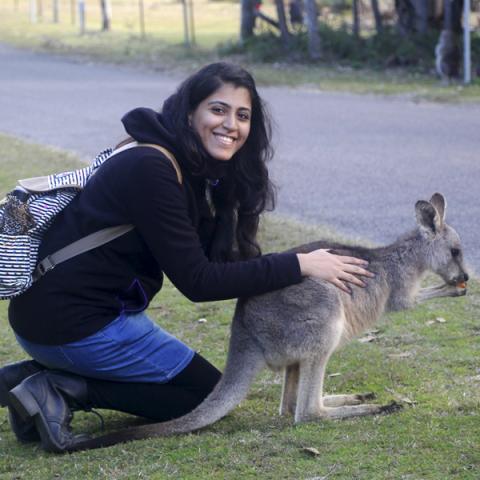 Aditi Taunk at rural road with a wallaby 