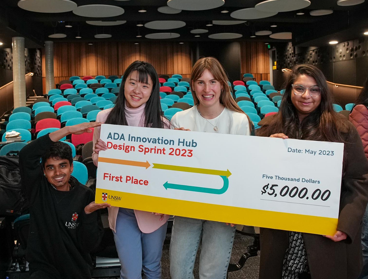 First place winning team from ADA Innovation Hub Design Sprint 2023 hold giant novelty cheque
