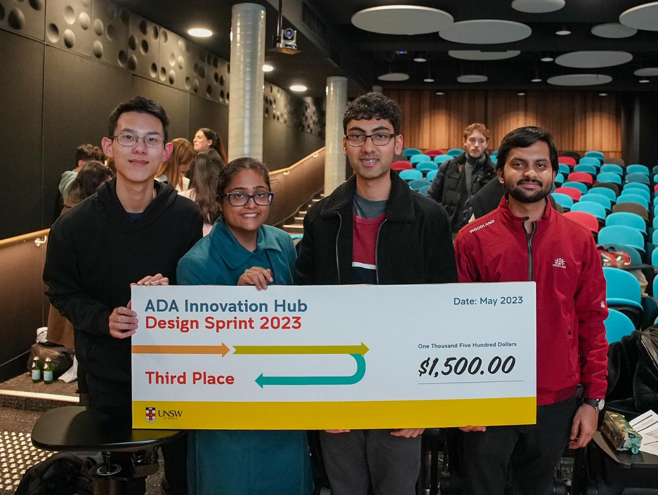 Third place winning team from ADA Innovation Hub Design Sprint 2023 hold giant novelty cheque
