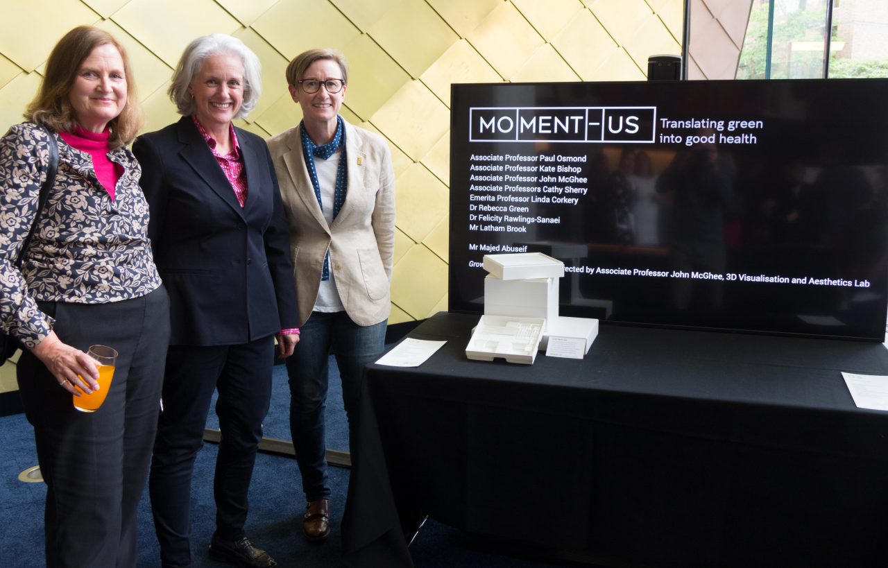 Team members representing 'Moment-us� pictured left to right include: Felicity Rawlings-Sanaei, Kate Bishop and Rebecca Green alongside a scale model of their proposal to establish interactive / edible green infrastructure and associated technologies for the HTH