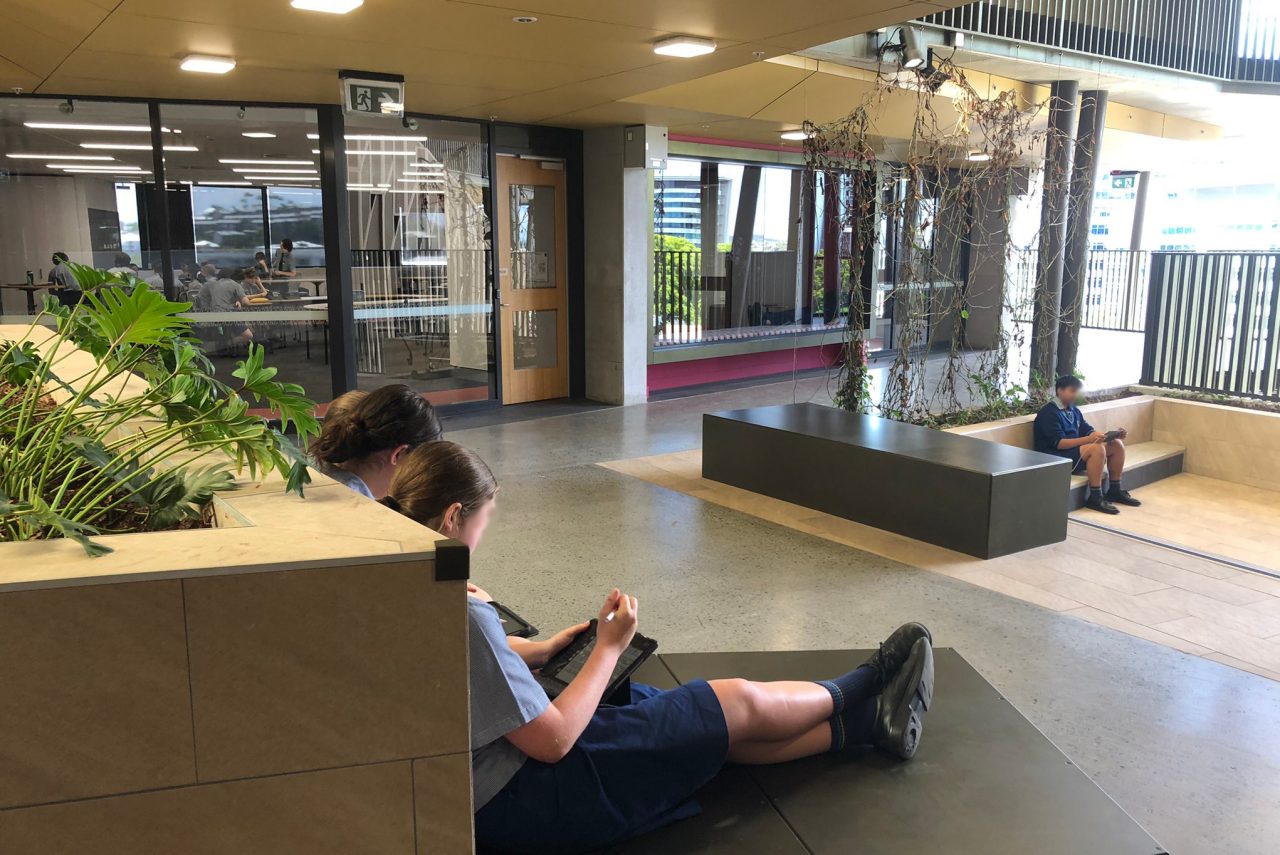 Students sitting in atrium