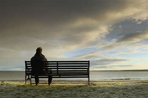 Elderly person on park bench