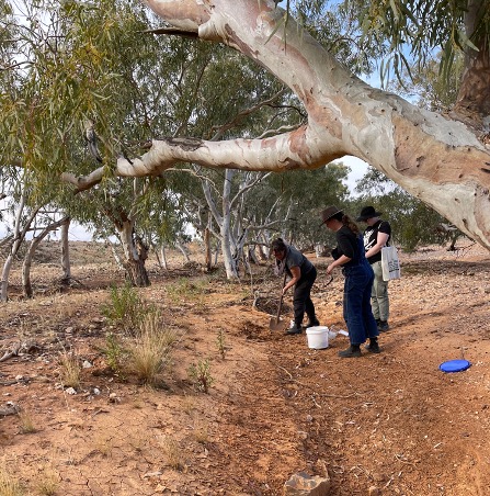 Students in the outback collecting different types of soil and rock 