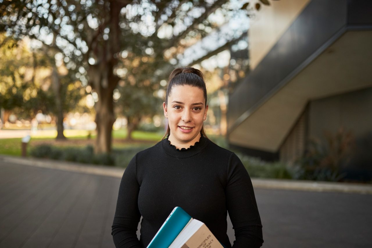 Law student portrait outside, in front of Law Building