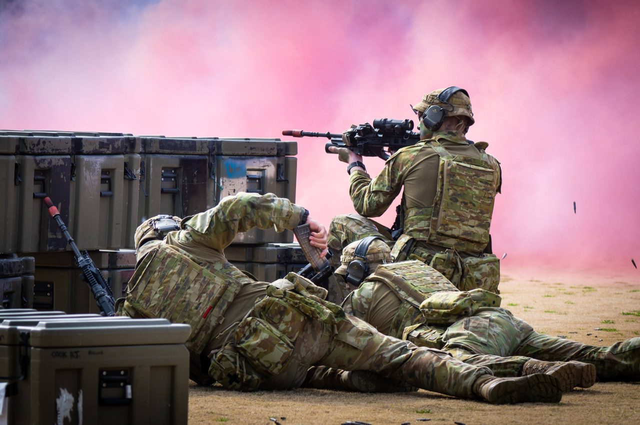 ADFA trainee officers perform a simulated ground-based infantry attack on the Academy’s parade ground during this year’s Open Day on 20 August 2022.