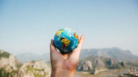 Photo of Hand holding small globe