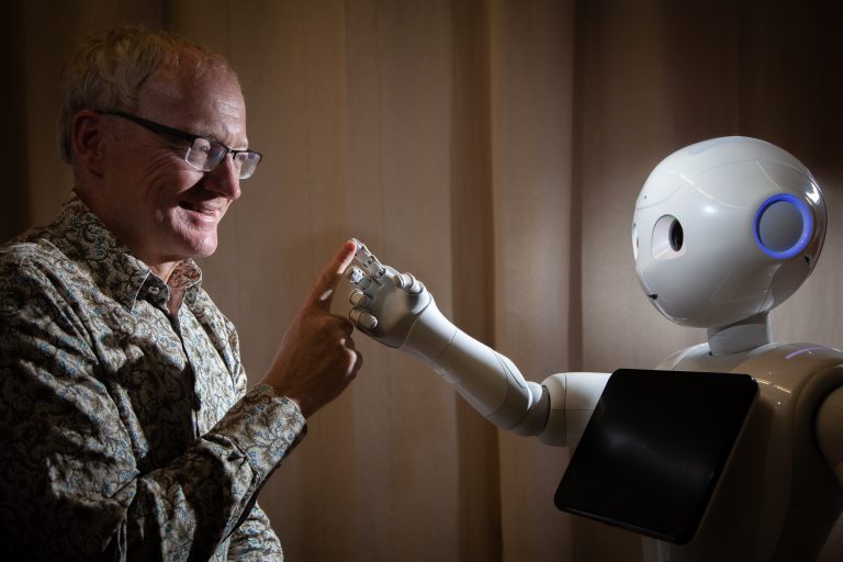 Professor Toby Walsh with robot