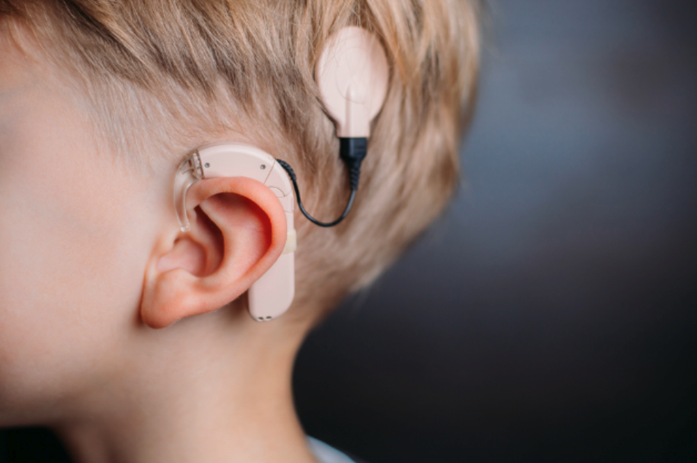 Child with hearing aid