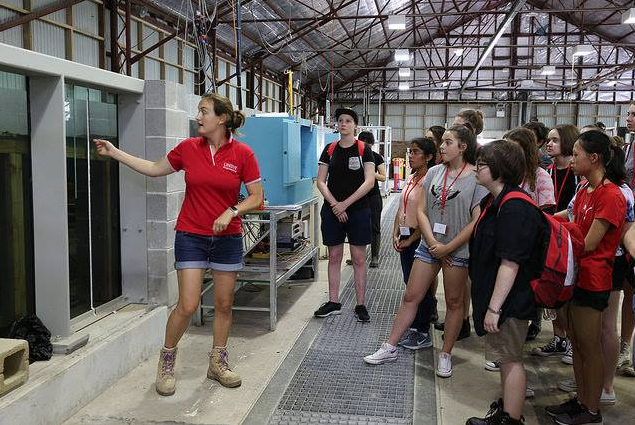 Kristen leading a tour of highschool  in the UNSW Water Research Laboratorygirls. 