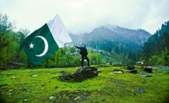 Pakistan flag and countryside