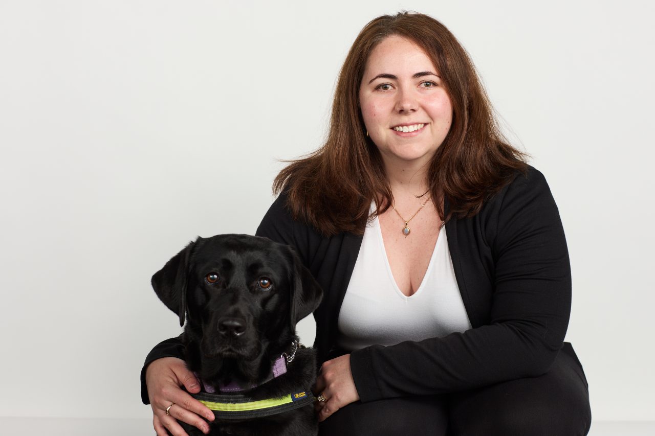 A portrait of Dr Leah Williams and her guide dog. 