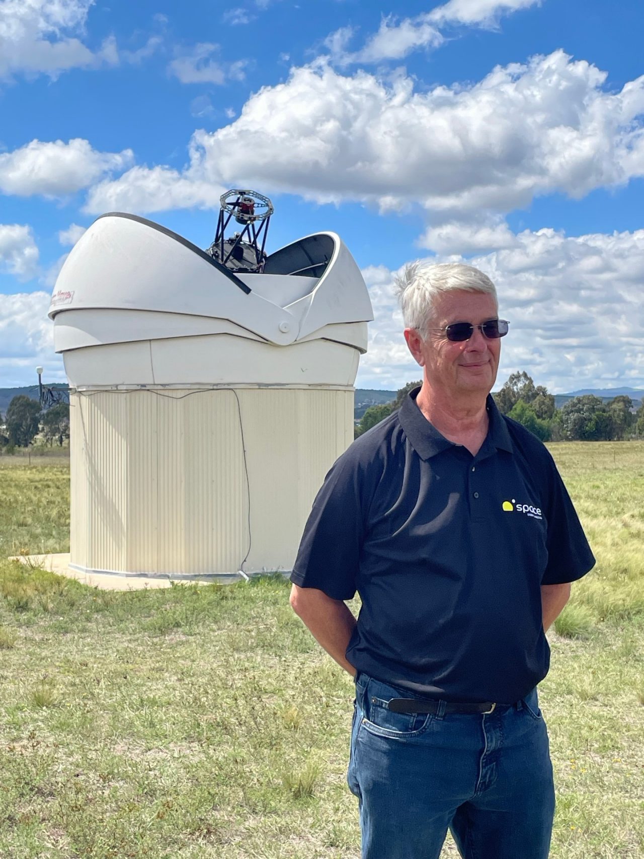Professor Ed Kruzins with the Falcon Telescope