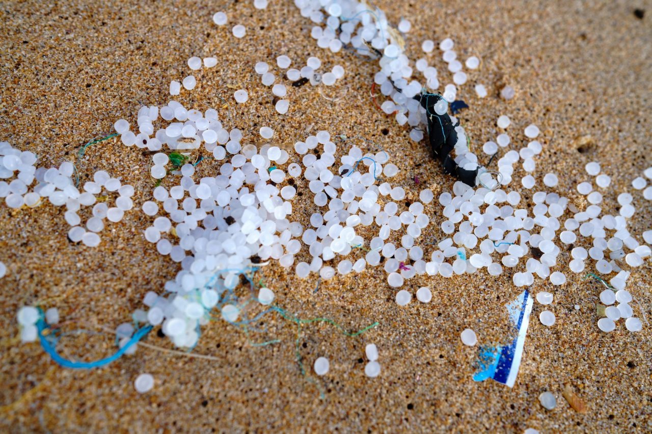 close up of plastic pellets or nurdles on beach in Sri Lanka