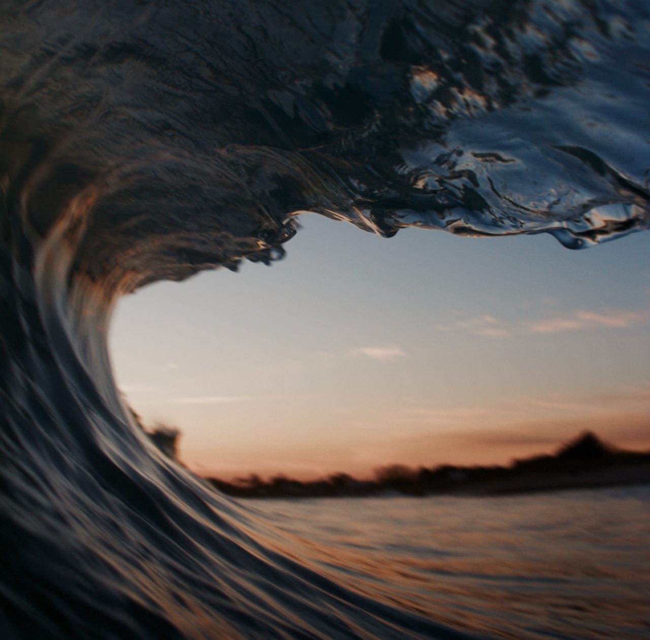Close up of an ocean wave at sunset
