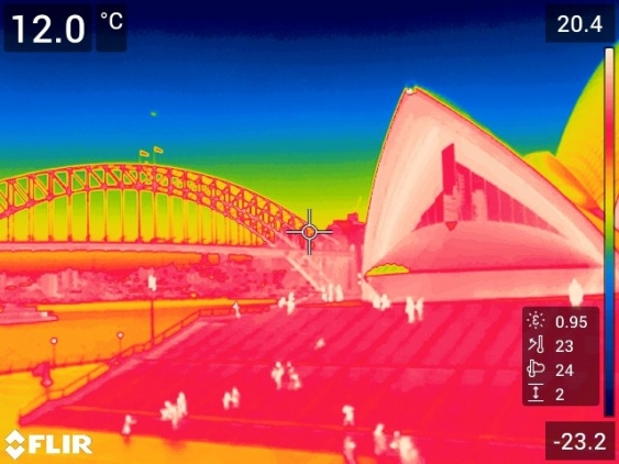 A thermal imaging camera highlights the amount of heat radiating from Sydney Harbour and its surroundings back into the atmosphere at night. 