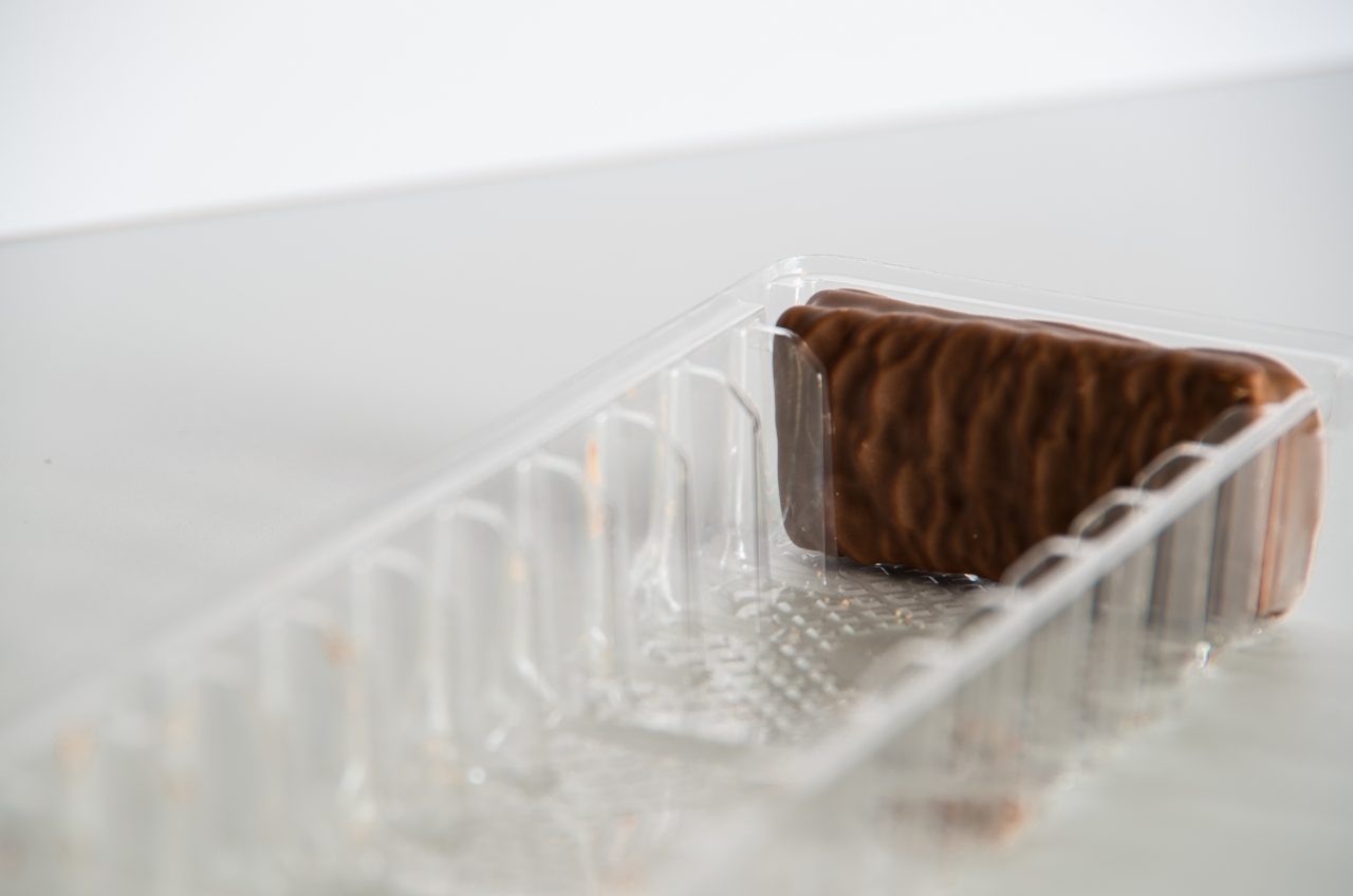 Last chocolate biscuit in a packaging on a white background