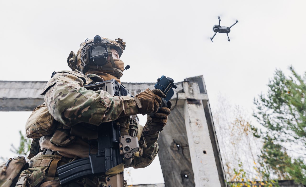 Soldier operates a small drone.