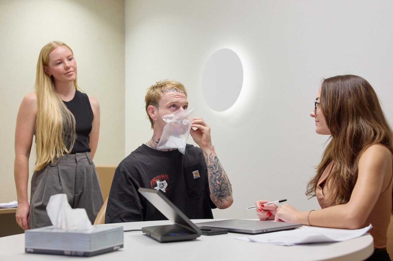 Merryn Baker, Angus Read and Laura Capasso at a clinic in Kent St where construction workers provide breath samples to be analysed for silicosis
