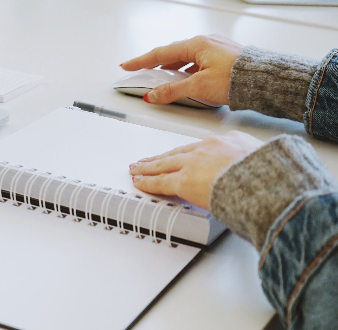 Photo of person with white spiral notebook