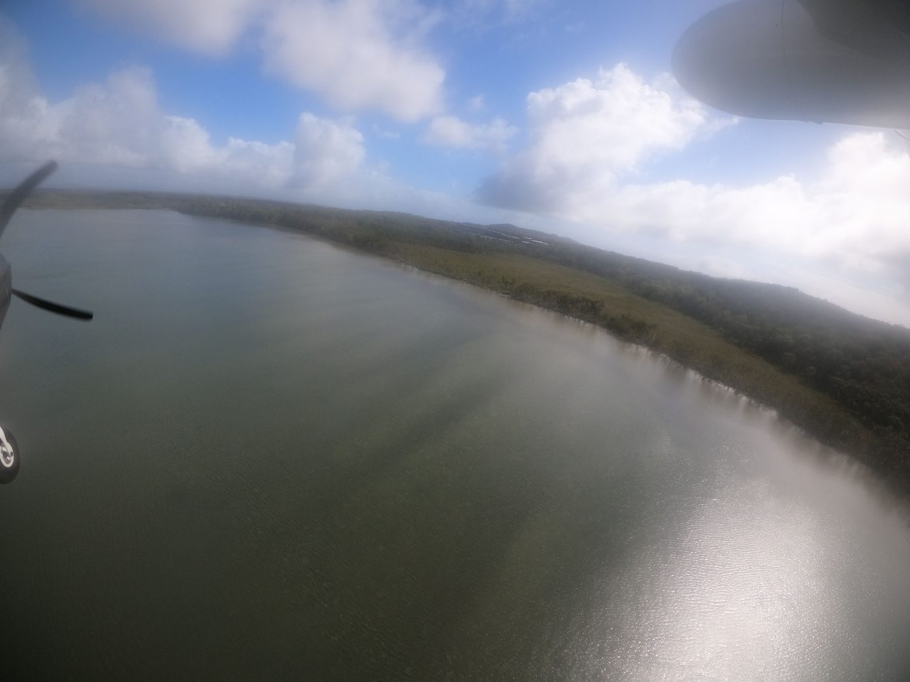 Aerial photo of coastal lake small hills in distance. 