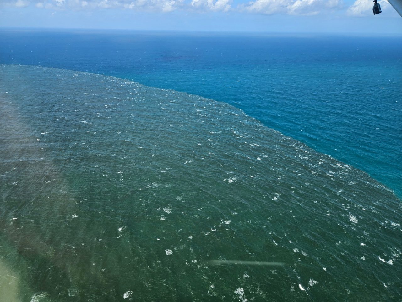 Aerial photo sediment plume flowing to ocean
