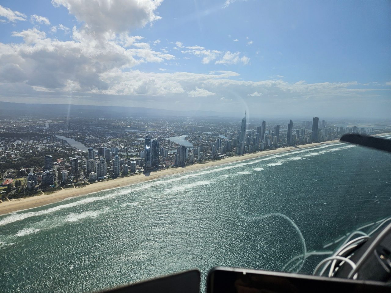 Aerial photo, city behind the beach