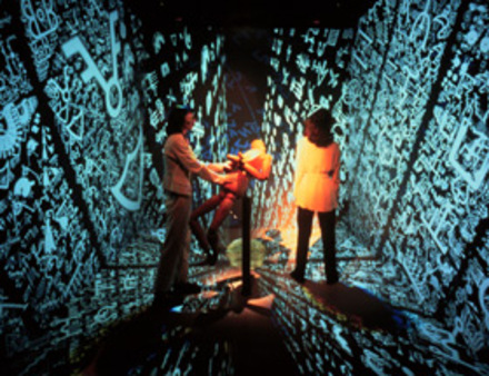 Installation view of ConFIGURING the CAVE showing people interacting with the installation.