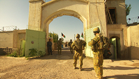 Screenshot from Retrospect showing soldiers in Afghanistan near an archway.