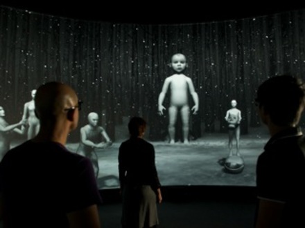 Installation view of Scenario featuring human figures of different ages.
