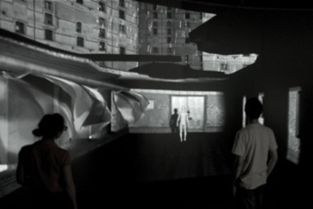 Scenario installation view, featuring a street and buildings.