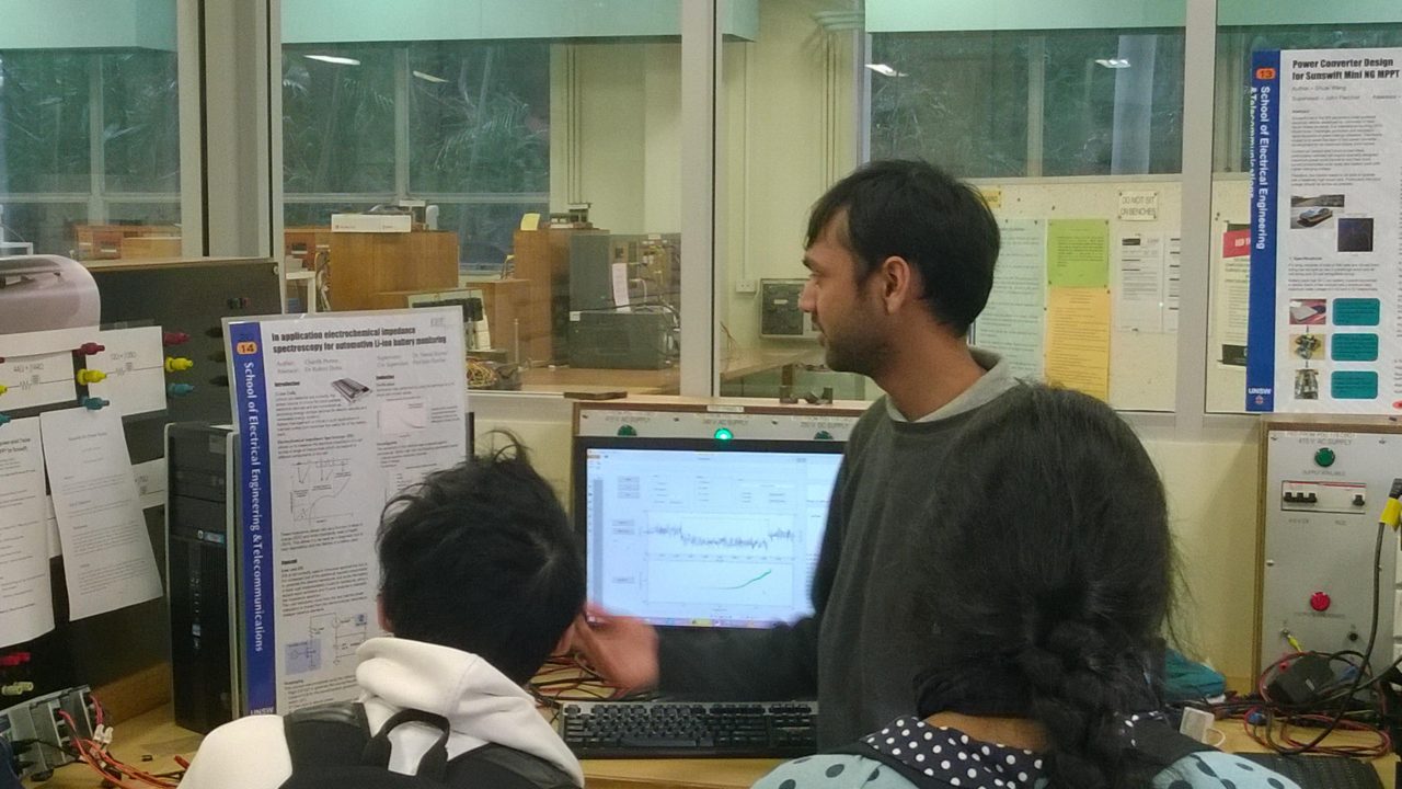 Charith in action, explaining his poster and constructed gadgets to follow students (30th May 2014)