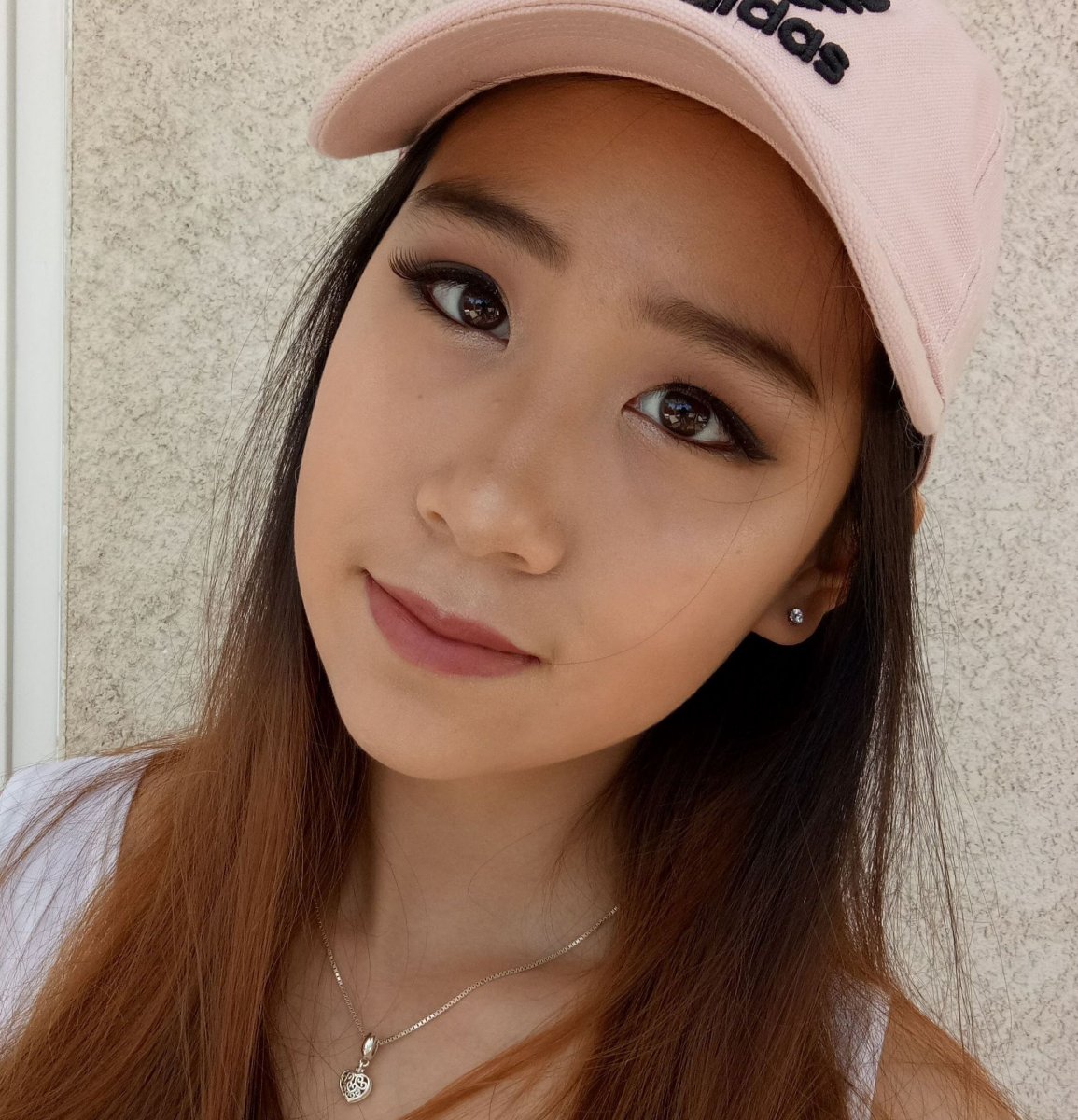 Young woman wearing pink hat - Serena Xu