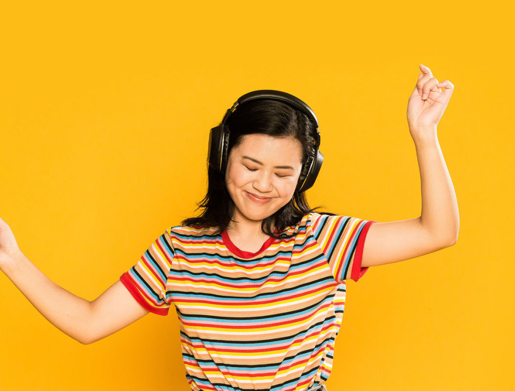 Young woman with headphones dancing 