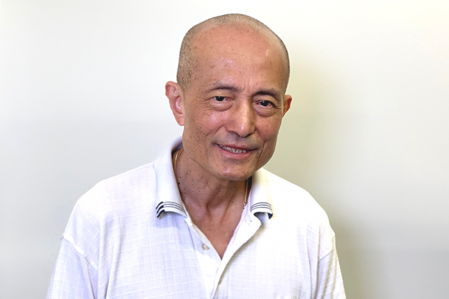 Dr. Siaw-Teng Liaw in a white collared shirt, posing with a subtle smile in front of a neutral background.